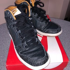 Women’s Nike high top sneakers.